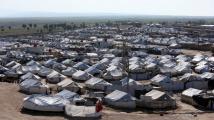 فرنسا أعادت نساء وأطفال كانوا في مخيمات تحتجز "دواعـ ـش" في سوريا